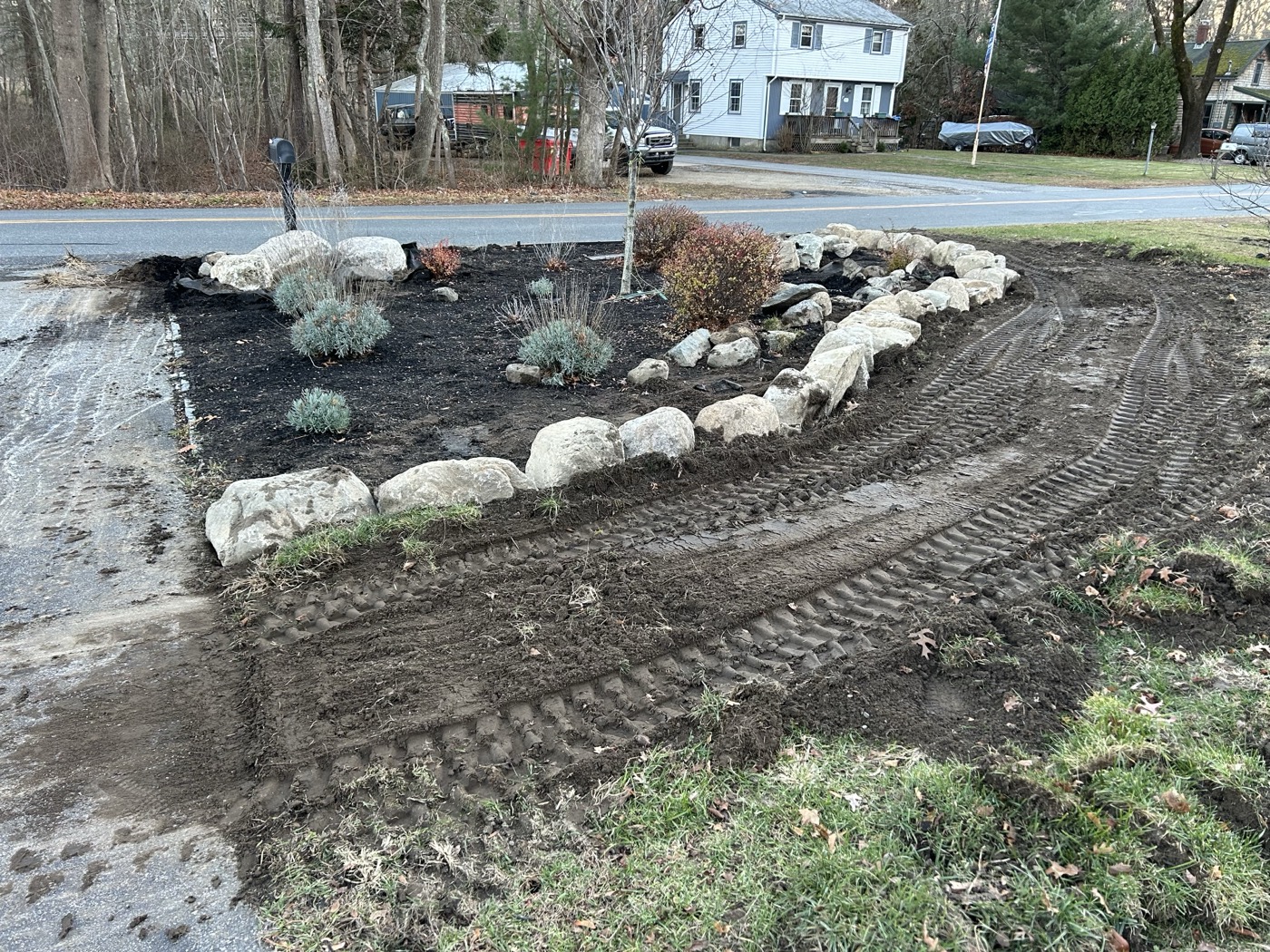 Site preparation — boulder border and landscaping