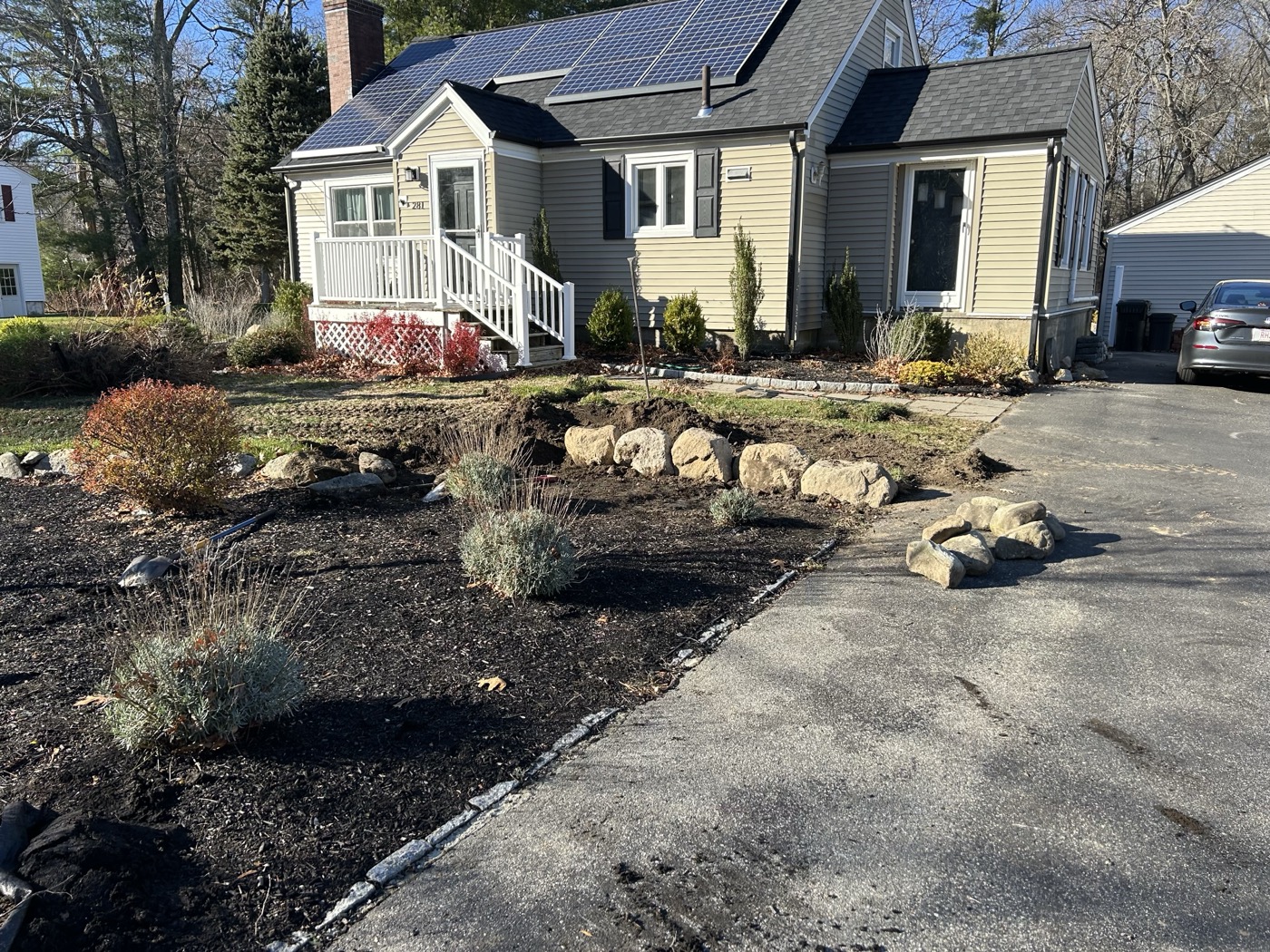 Completed boulder retaining wall and front yard restoration